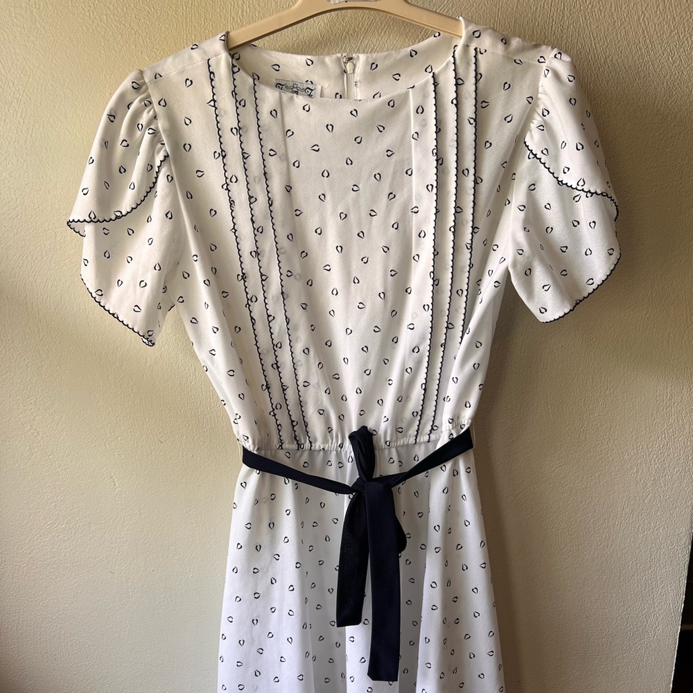 Vintage white dress with blue accents.